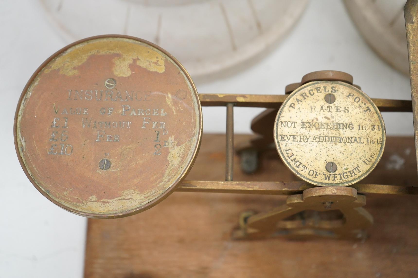A set of brass and mahogany Avery postal scales and weights, 37cm wide